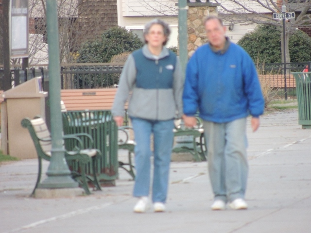 couples in blue walking together,images