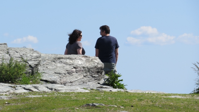 couple sitting on rock together,love pic