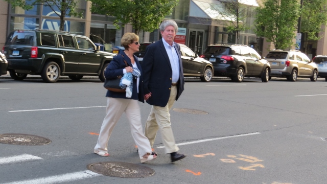 dressed alike couple crossing street,display pictures
