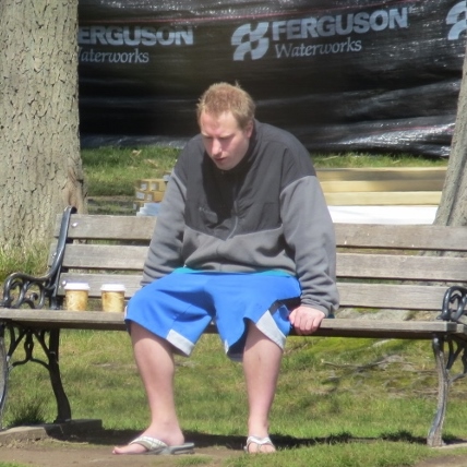 man sitting on bench head down,loves displays pictures