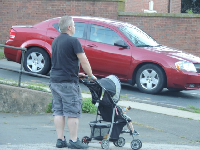 man with child in stroller,images pictures