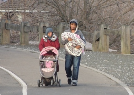 muslim man holding new baby,display of love