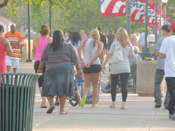 people walking on boardwalk,love display of pictures