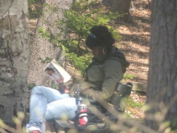 woman reading under tree, profitable lifestyle idea