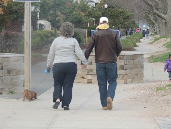 couples walking a dog,dog products ideas