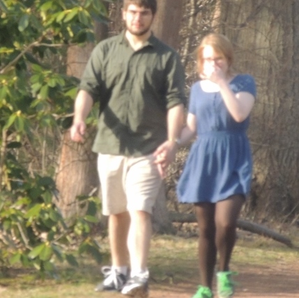 young couple walking hand in hand,love display